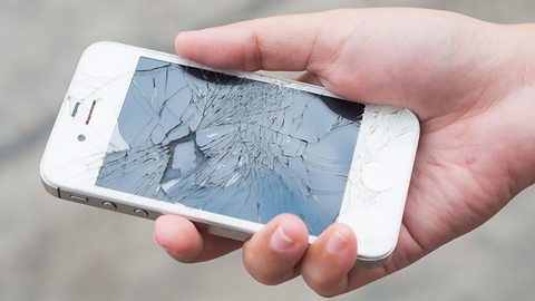 Photo of a smart phone with a broken screen