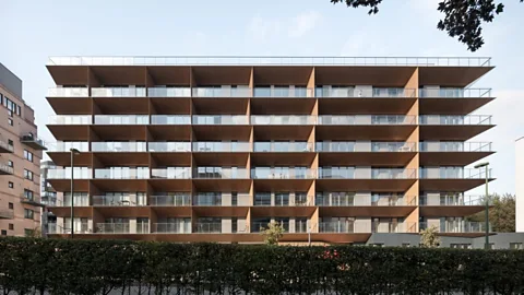 A2M architects A building with unusually angled balconies can bump the internal temperature up by a few crucial degrees (Credit: A2M architects)