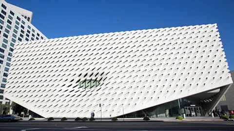 Alamy The Broad in downtown LA is a startling, white-metallic structure, perforated by angular gashes (Credit: Alamy)