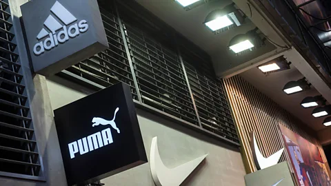 Alamy Global sportswear brands Adidas and Puma were created by competing German brothers who both left their family's once-unified shoe business (Credit: Alamy)