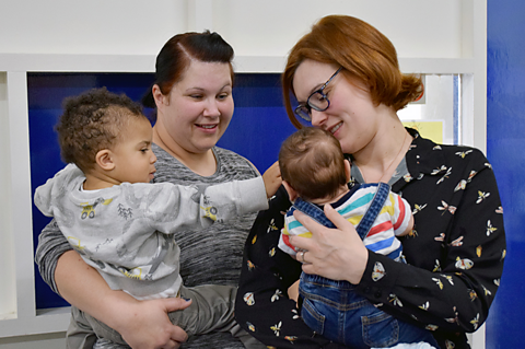 Two mums and their babies at a stay and play group.