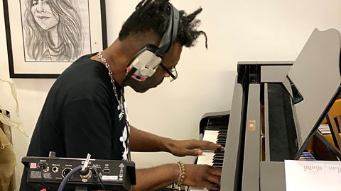 Omar recording the song 'Dream On' at the Piano