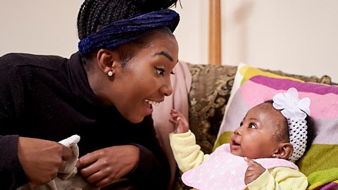 Mum smiling at her baby face to face