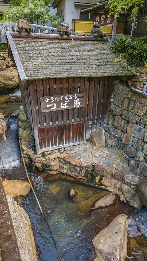 VW Pics/Contributor/Getty Images Of the more than 3,000 onsen in Japan, the tiny hut at Yunomine is believed to be the oldest (Credit: VW Pics/Contributor/Getty Images)