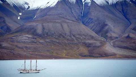 Werner Hoffmann sailing ship in front of mountains Longyearbyen, Svalbard, Norway (Credit: Werner Hoffmann)