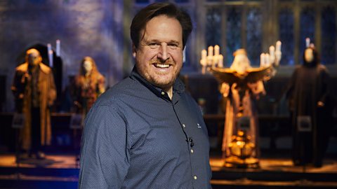 Christian Manz in the Great Hall, smiling.