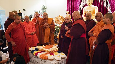 Monks at Hivin's Vihara receiving their new robes which are donated by the local Buddhist community.