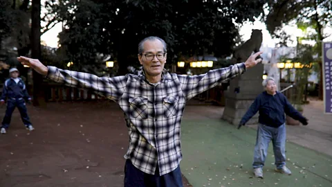 Senior citizens exercising in the park