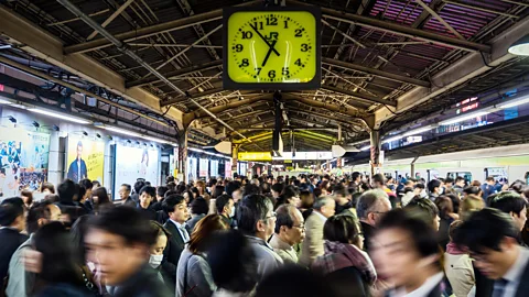 Alamy The daily hustle and bustle of life as a commuter is governed by the ticking of clocks, something that modern technology has made worse (Credit: Alamy)