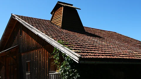_laurent/Getty Images Tuyés (chimneys) for smoking meat can still be seen in farmhouses in the area today (Credit: _laurent/Getty Images)