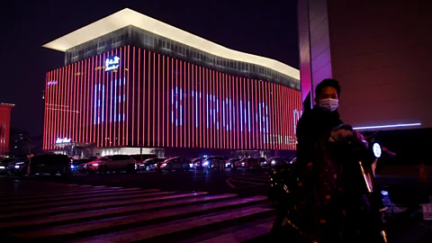 Getty Images A message of support which reads "Be Strong China" is seen on a building in Beijing amid the country's Covid-19 coronavirus outbreak (Credit: Getty Images)