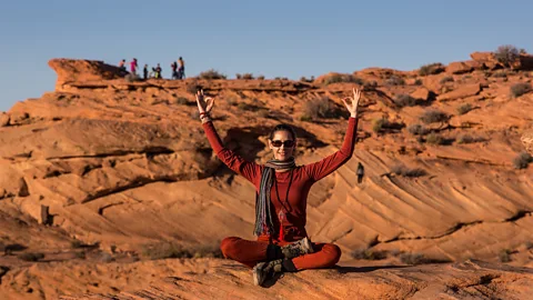 Getty Images Workcations create social distancing by giving you solitary time in nature, and involve scheduled physical activities such as yoga or skiing. (Credit: Getty Images)