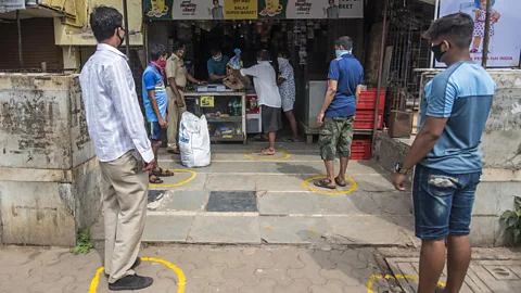 Hindustan Times/Getty Images Authorities are teaching Indians how to queue at healthy social distances with chalk-drawn circles (Credit: Hindustan Times/Getty Images)