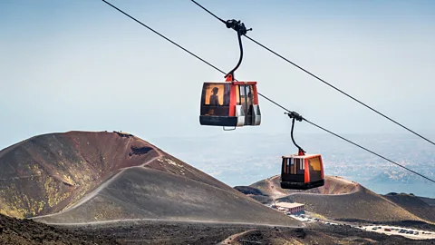 Alexander Nikiforov/Getty Images Ski lifts take people up closer to Etna's summit (Credit: Alexander Nikiforov/Getty Images)