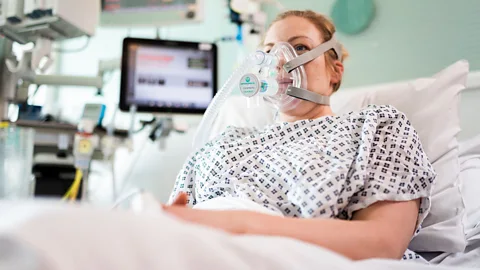 Getty Images A volunteer wears the breathing aid developed by engineers, doctors and the Mercedes Formula One team in conjunction with University College London (Credit: Getty Images)