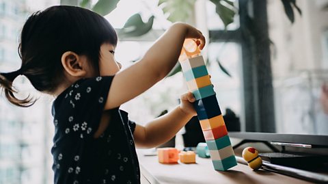 Girl building blocks