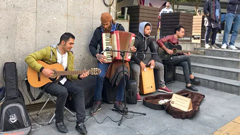 Sarah Reid Kindness is rooted in Persian culture, with buskers inviting passers-by to take their earnings if they need it (Credit: Sarah Reid)