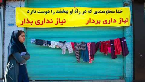 Eric Lafforgue/Getty Images “Walls of kindness” originated in Mashhad in north-east Iran in 2015, but quickly spread throughout the country (Credit: Eric Lafforgue/Getty Images)