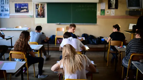 Getty Images Some surveys found those with helicopter parents were less confident in their abilities and struggled with decision-making and exams (Credit: Getty Images)