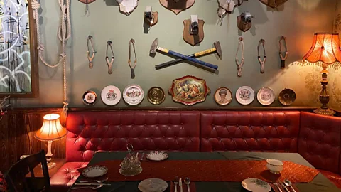 Surveillance cameras mounted like hunting trophies line the lobby of The Walled Off hotel (Richard Morgan)