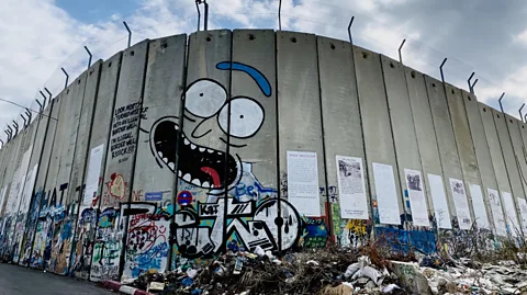 The separation barrier is covered in graffiti and messages from street artists and advocacy groups from around the world (Richard Morgan)