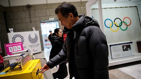 Getty Images People from all over Japan donated their old electronic devices to provide metal for 5,000 gold, silver and bronze Olympic medals (Credit: Getty Images)