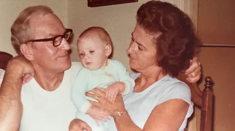 Melissa Banigan The writer as a baby with her grandparents in 1976 (Credit: Melissa Banigan)