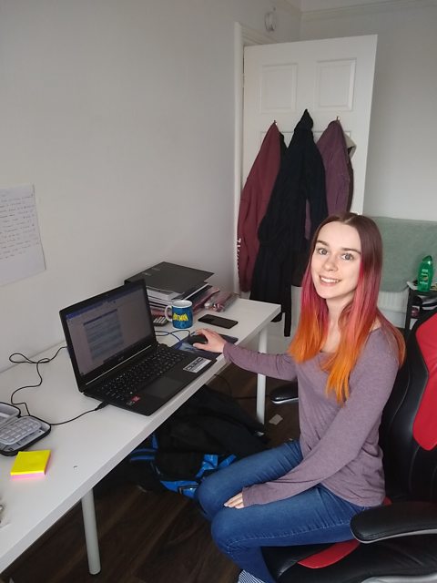 Joanne at her desk