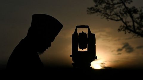 A Muslim man awaits the arrival of the New Moon at the end of Ramadan