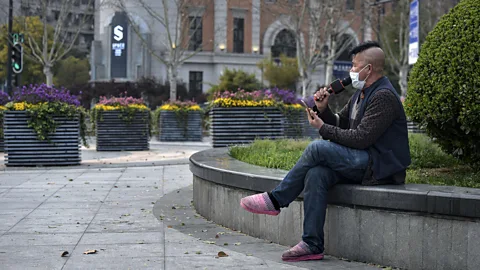 Barcroft Media/Getty Images Coronavirus has seemed to revive the Chinese knack for subtle self-depreciation, like this man filming himself singing karaoke solo in Wuhan (Credit: Barcroft Media/Getty Images)