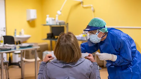 Getty Images health worker swabs a patient to test for Covid-19 (Credit: Getty Images)