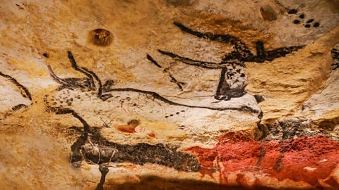 Images of animals in the Lascaux Cave with dots representing stars