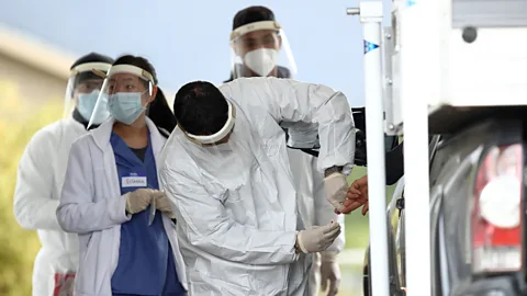 Getty Images A medical professional administers a Covid-19 test in Bolinas, California on 20 April 2020; the town is attempting to test each of its 1,600 residents (Credit: Getty Images)