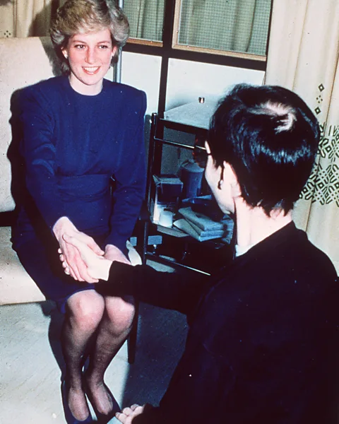 Getty Images When the late Princess of Wales took the hand of an HIV patient in hospital it helped to dispel some of the stigma surrounding the disease (Credit: Getty Images)