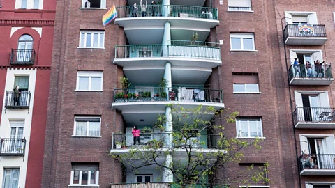 Getty Apartment residents in Madrid have been maximising use of their balconies during the lockdown period (Credit: Getty)