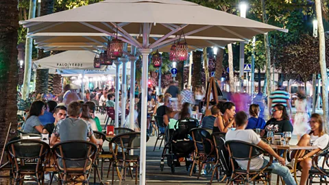 Getty Spaniards spend more time socialising outside the home than residents of many other European nations (Credit: Getty)