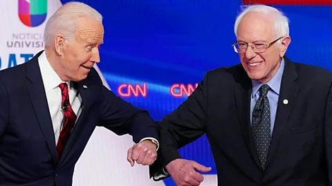 Mandel Ngan/Getty Images Popularised by many high-profile politicians, the elbow bump has replaced the handshake in parts of the US (Credit: Mandel Ngan/Getty Images)
