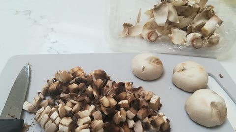 Mushrooms with peelings next to them 