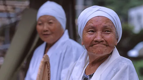 Alamy Social interaction and spirituality were both found to be common among 100 year olds in places like Okinawa (Credit: Alamy)