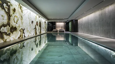 SolidNature Dutch design company SolidNature’s basement swimming pool, created with back-lit golden onyx (Credit: SolidNature)