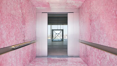 SolidNature The shiny pink lift at the Prada Foundation in Venice was created by SolidNature using a dyed block of onyx (Credit: Marco Guastalla)