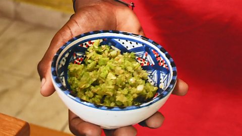 Roy holding a bowl of spices