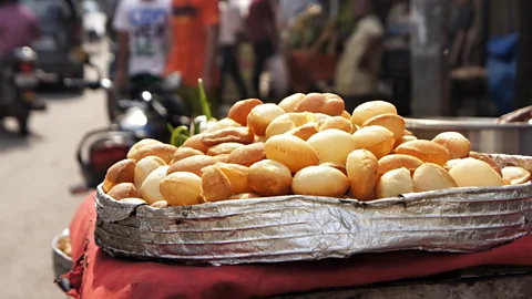 EyeEm/Alamy Puris are discs of dough that puff up upon frying to create a hollow core (Credit: EyeEm/Alamy)