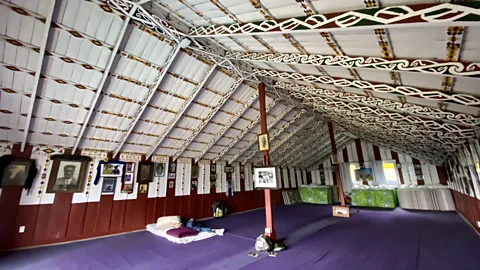 Jacqui Gibson Visitors can stay on marae (traditional Māori meeting grounds), such as Maungapōhatu marae with its ornate, painted interior (Credit: Jacqui Gibson)