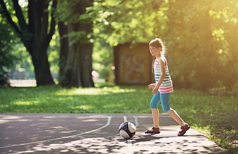 Girl playing football