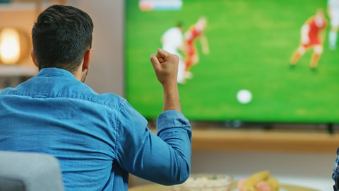 Man watching football on television