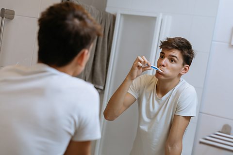 Boy brushing his teeth