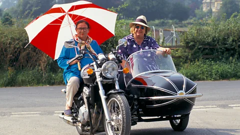 Alamy The Two Fat Ladies, aka Clarissa Dickson-Wright and Jennifer Paterson, roared around the UK on a motorbike and sidecar, and like Floyd brought verve to food TV (Credit: Alamy)