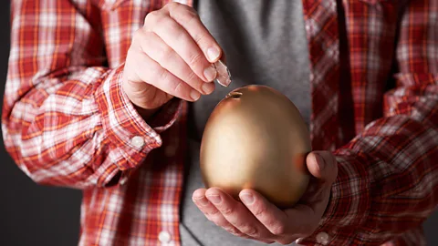 Alamy One study showed how volunteers opened virtual boxes of money and would only share failures (losing money) than successes (winning money) with others (Credit: Alamy)