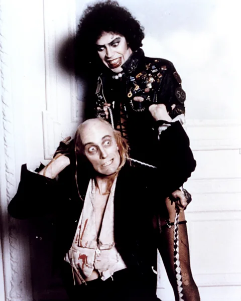 Alamy Richard O’Brien (writer of the original stage musical, and co-writer of the film) stars as a servant to Tim Curry’s Dr Frank-N-Furter (Credit: Alamy)